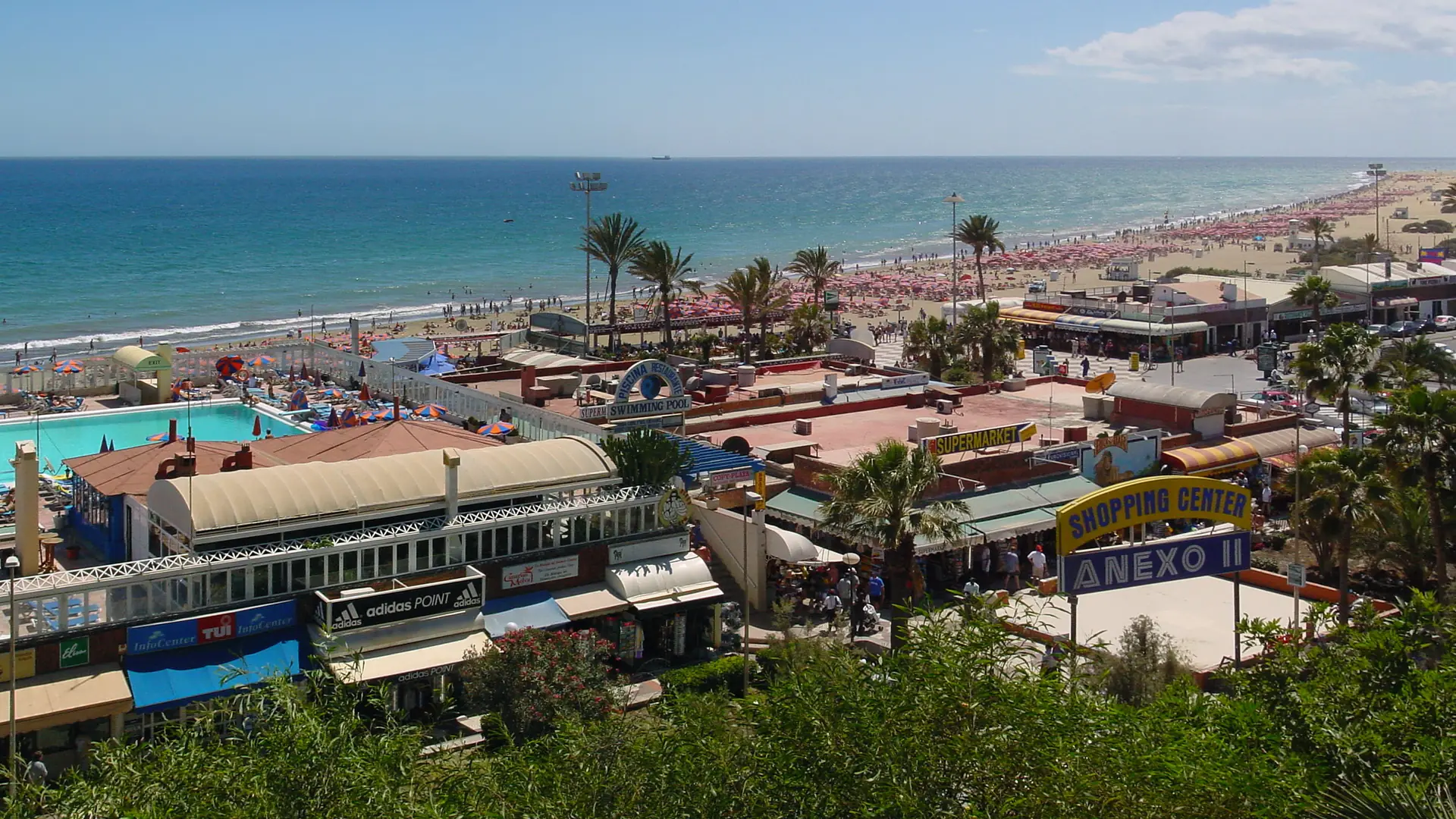 The beachfront shopping centre and pools above the long sandy beach at Playa del Inglés, southern Gran Canaria