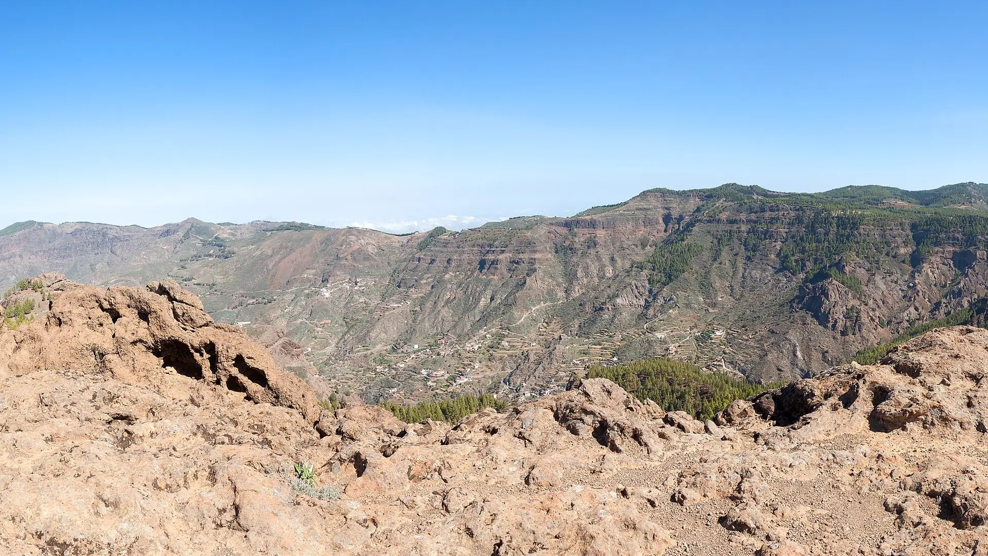Terraced hillsides and mountain roads dropping into the Barranco de Tejeda in the interior of Gran Canaria