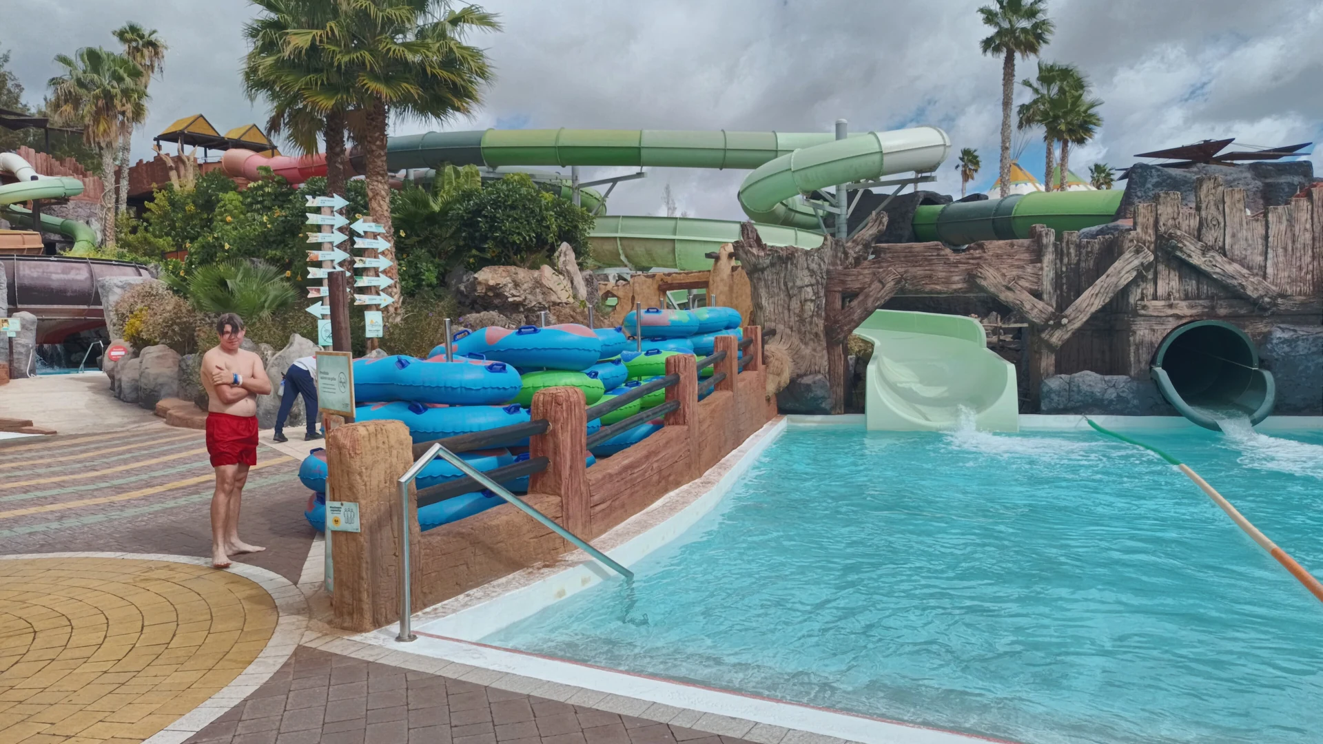 Water slides ending in a splash pool at Aqua Rancho, the water park inside Rancho Texas Park in Puerto del Carmen, Lanzarote