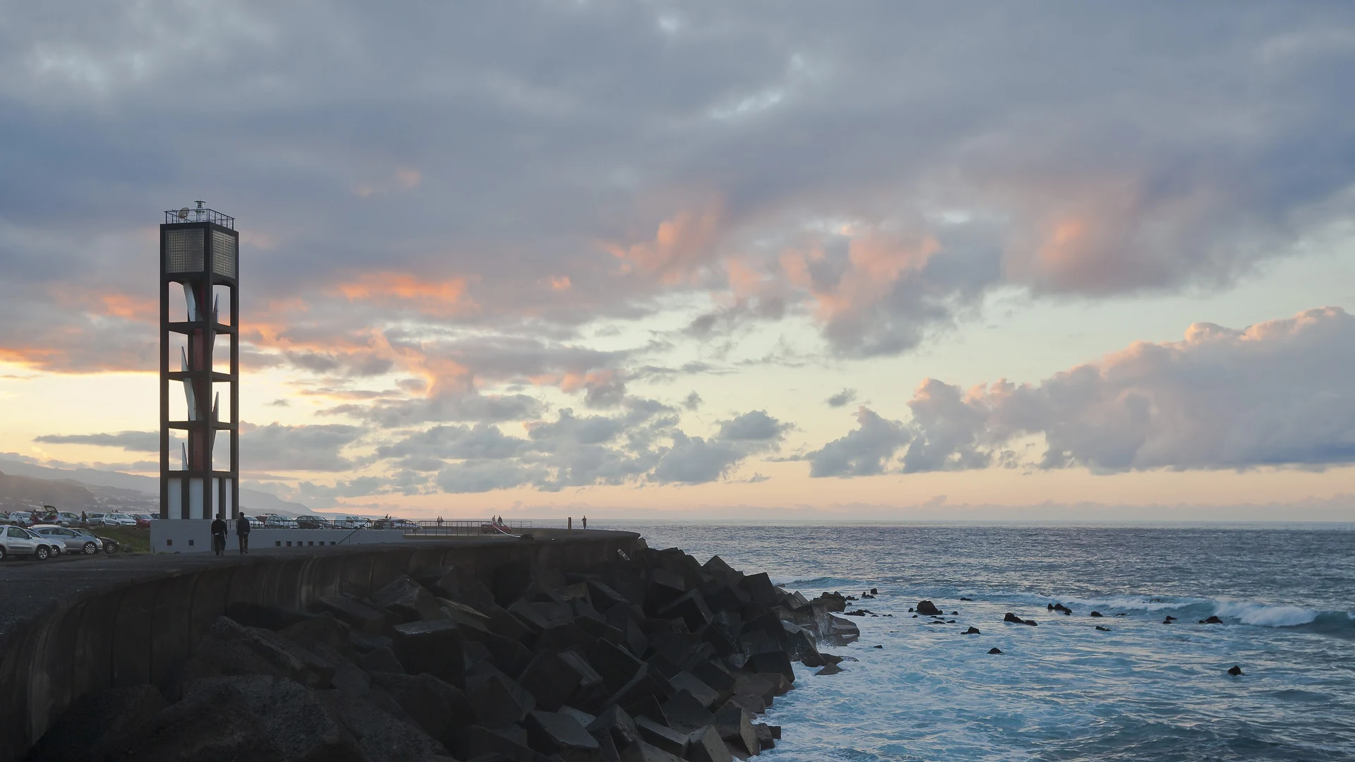 The lighthouse and harbour wall at Puerto de la Cruz on the north coast of Tenerife